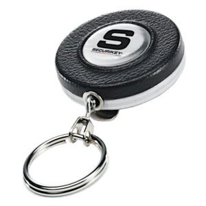 Round black leather key fob with a silver Securikey emblem and an attached metal key ring accessory