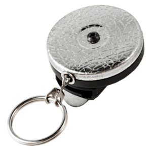 Circular metal cap with a cracked texture mounted on a black base, attached to a keyring (keychain accessory).