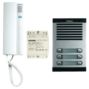 Left-to-right view of a building intercom kit: a wall-mounted white handset with coiled cord, a white power supply module, and a gray Fermax multi-door entry panel with four horizontal slots.