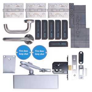 A complete door hardware kit with multiple metal hinges, a U-shaped door handle, a lever/arm closer, assorted strike plates, lock mechanisms, blue circular 'Fire door keep shut' signs, black modular strips, and mounting plates for a secure door system.