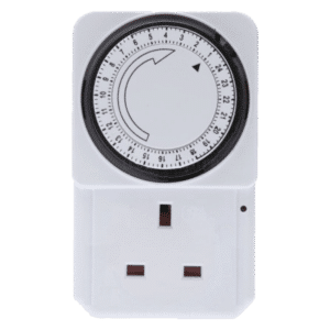 Plug-in mechanical timer with circular dial mounted above a white outlet plate.