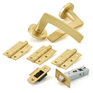 Brass door hardware set with a handle, hinges, latch, strike plate, and latch mechanism pieces laid out on a white background